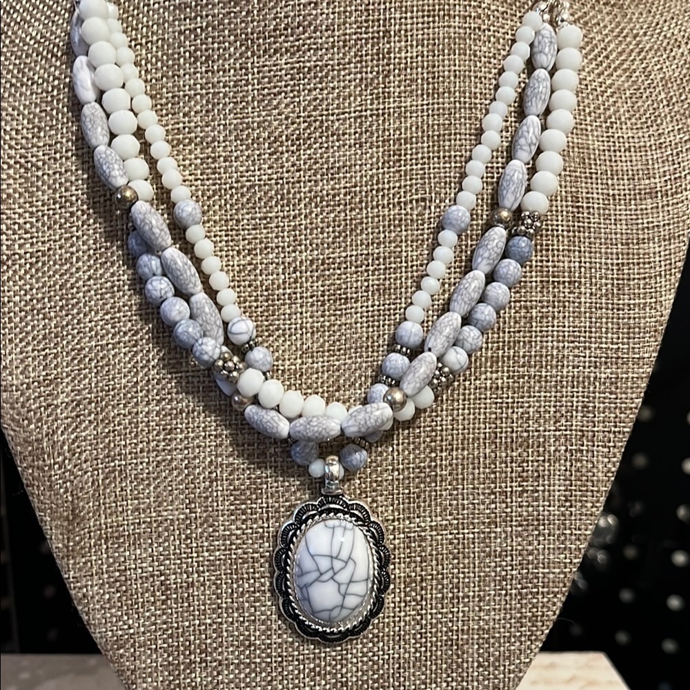 Gray and white stone look necklace, appears to be new.